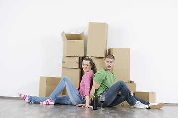 Image showing Young couple moving in new home