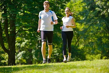 Image showing Young couple jogging