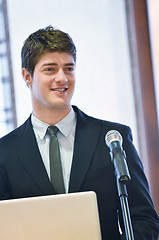 Image showing Young  business man giving a presentation on conference