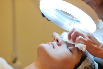 Image showing woman with facial mask in cosmetic studio