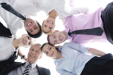 Image showing business people with their heads together