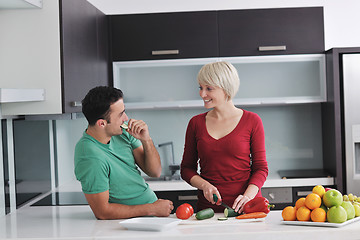 Image showing young couple have fun in modern kitchen