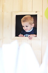 Image showing happy child in a window
