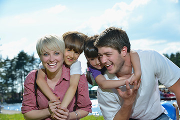 Image showing happy young family have fun outdoors