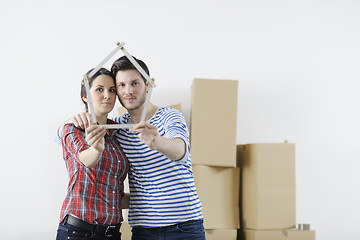 Image showing Young couple moving in new home