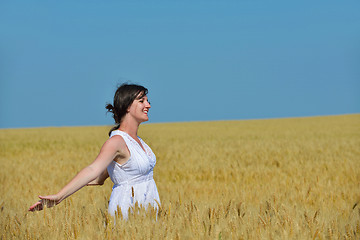 Image showing young woman in wheat field at summer