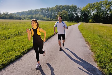 Image showing Young couple jogging