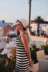 Image showing Greek woman on the streets of Oia, Santorini, Greece