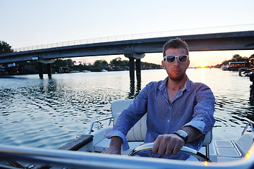 Image showing portrait of happy young man on boat