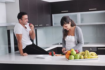 Image showing young couple have fun in modern kitchen