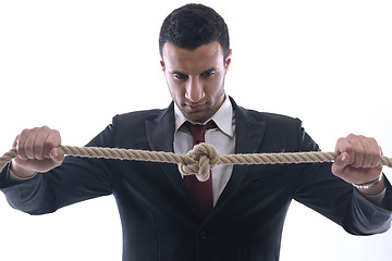 Image showing business man with rope isolated on white background