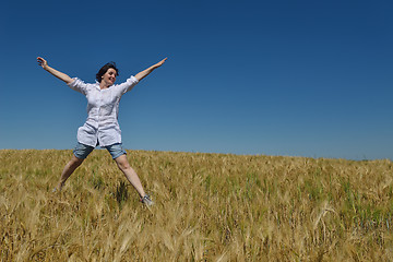 Image showing young woman in wheat field at summer