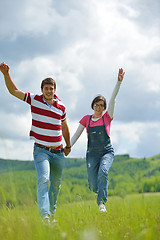 Image showing Portrait of romantic young couple smiling together outdoor