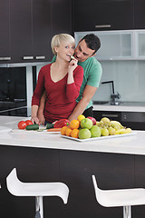 Image showing young couple have fun in modern kitchen