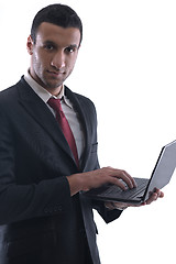 Image showing business man work on mini laptop