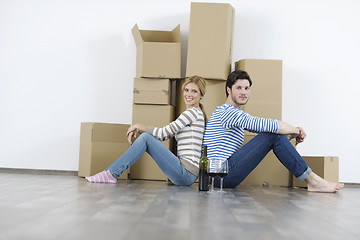 Image showing Young couple moving in new home