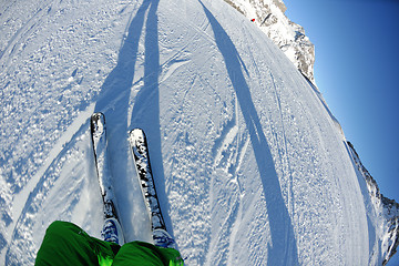 Image showing skiing on fresh snow at winter season at beautiful sunny day