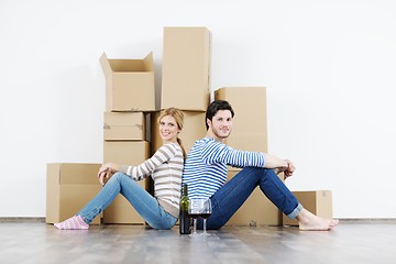 Image showing Young couple moving in new house