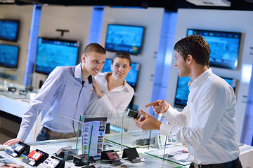 Image showing Young couple in consumer electronics store