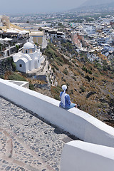 Image showing Greek woman on the streets of Oia, Santorini, Greece