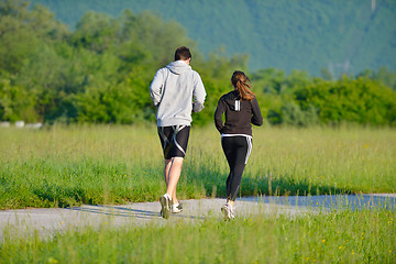 Image showing Young couple jogging