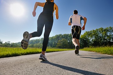 Image showing Young couple jogging