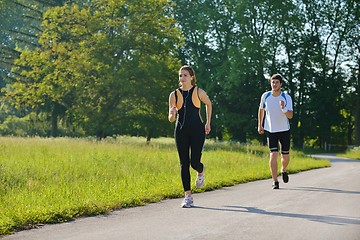 Image showing Young couple jogging at morning