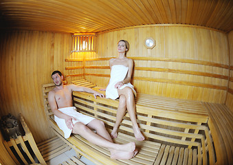 Image showing happy young couple in sauna