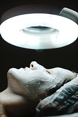 Image showing woman with facial mask in cosmetic studio