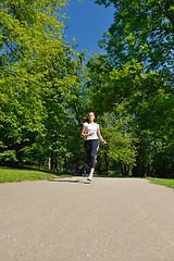 Image showing Young beautiful  woman jogging