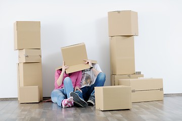 Image showing Young couple moving in new house