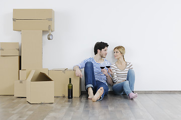 Image showing Young couple moving in new home