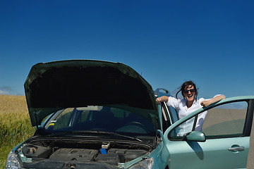 Image showing woman with broken car