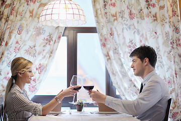 Image showing young couple having dinner at a restaurant