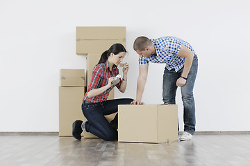 Image showing Young couple moving in new home