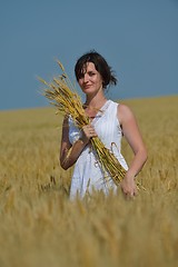 Image showing young woman in wheat field at summer