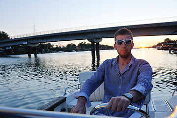 Image showing portrait of happy young man on boat