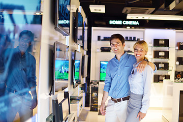 Image showing Young couple in consumer electronics store