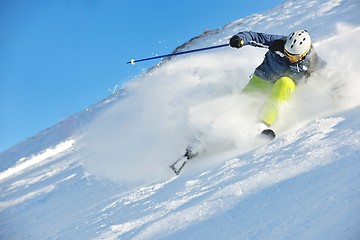 Image showing skiing on fresh snow at winter season at beautiful sunny day