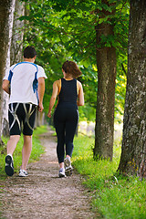 Image showing Young couple jogging at morning