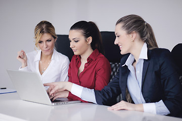 Image showing business woman group with headphones