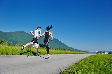 Image showing Young couple jogging