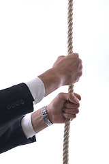 Image showing business man with rope isolated on white background