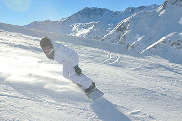 Image showing skiing on fresh snow at winter season at beautiful sunny day