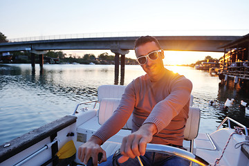 Image showing portrait of happy young man on boat