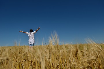 Image showing young woman in wheat field at summer