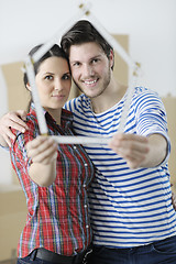 Image showing Young couple moving in new home