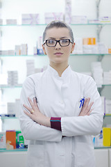 Image showing pharmacist chemist woman standing in pharmacy drugstore