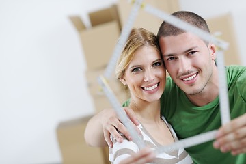 Image showing Young couple moving in new house