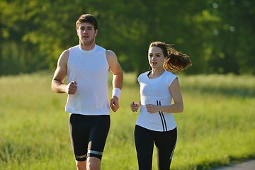 Image showing Young couple jogging at morning